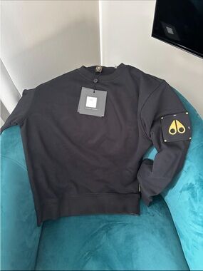 Moose Knuckles Black Crewneck Sweatshirt with Gold Sleeve Patch